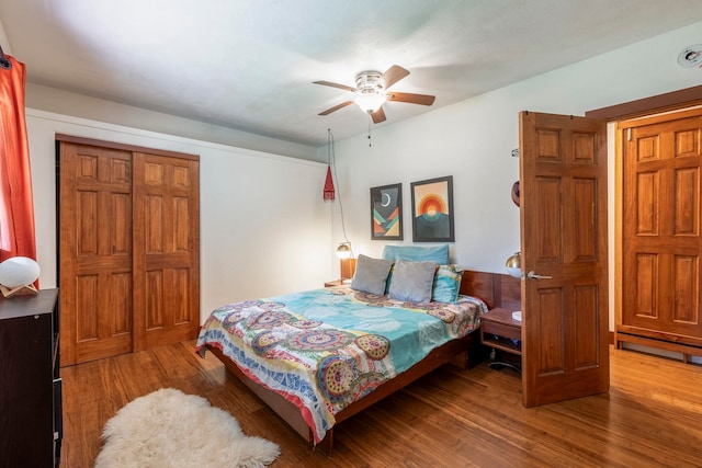 bedroom featuring a closet, ceiling fan, and wood-type flooring