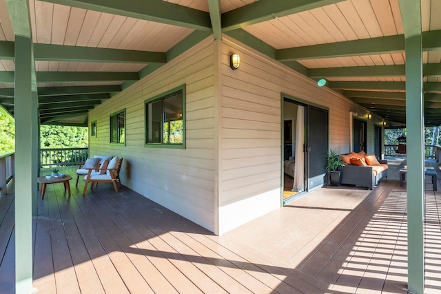 wooden terrace featuring outdoor lounge area