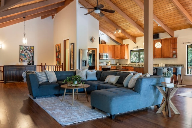 living room with wooden ceiling, high vaulted ceiling, dark wood-type flooring, and beamed ceiling