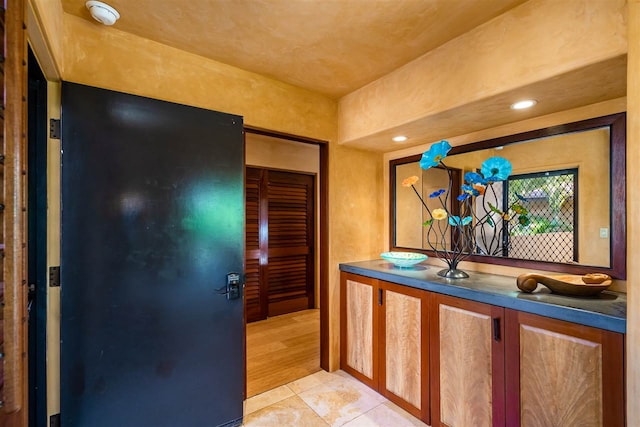 hallway with light tile patterned floors