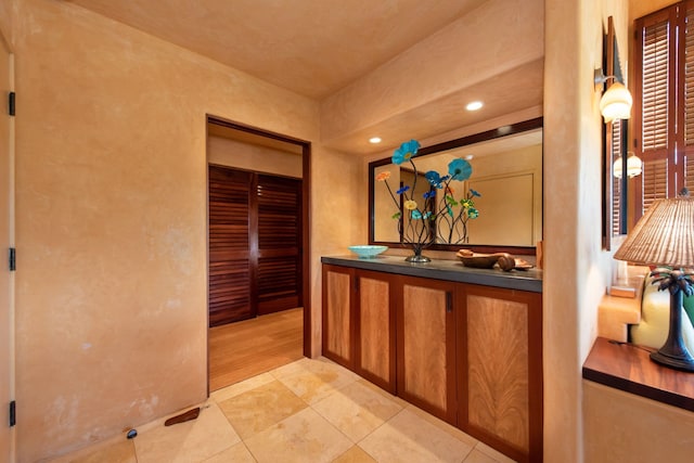 hallway featuring light tile patterned floors