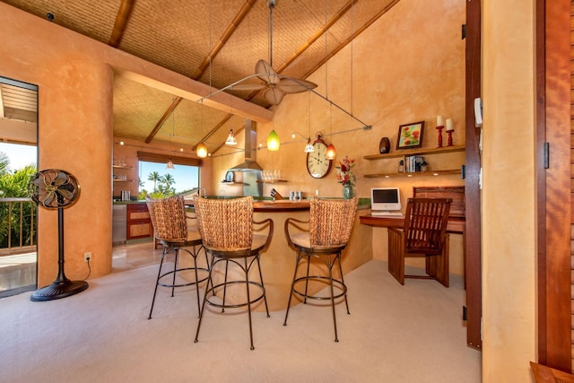 bar with light carpet, island range hood, high vaulted ceiling, beamed ceiling, and hanging light fixtures