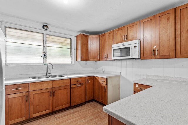 kitchen featuring light hardwood / wood-style floors and sink