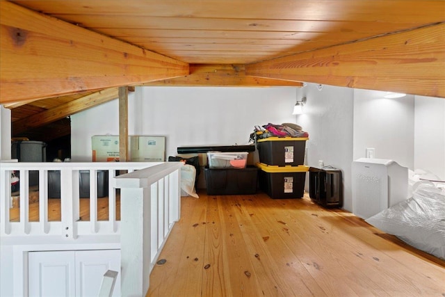 additional living space with wooden ceiling and wood-type flooring