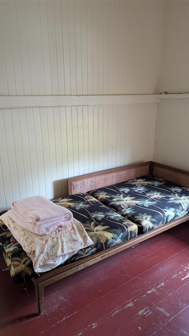 bedroom with wooden walls