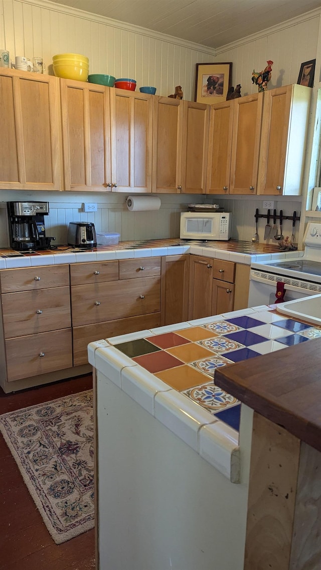 kitchen with light brown cabinets, backsplash, tile counters, and white appliances