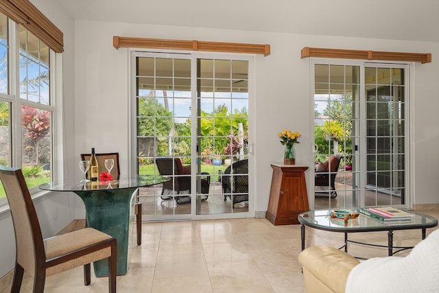 doorway featuring light tile patterned flooring and plenty of natural light