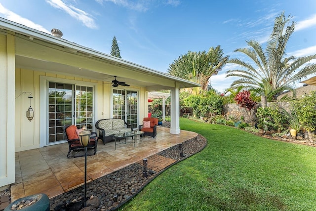 view of yard with an outdoor hangout area, a patio, and ceiling fan