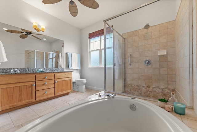 full bathroom featuring toilet, vanity, independent shower and bath, ceiling fan, and tile patterned flooring