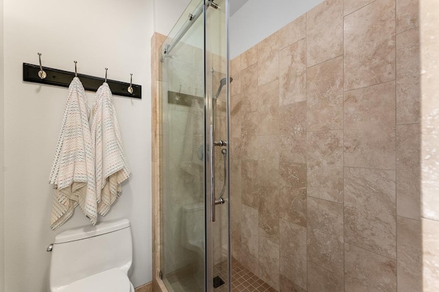 bathroom with walk in shower and toilet