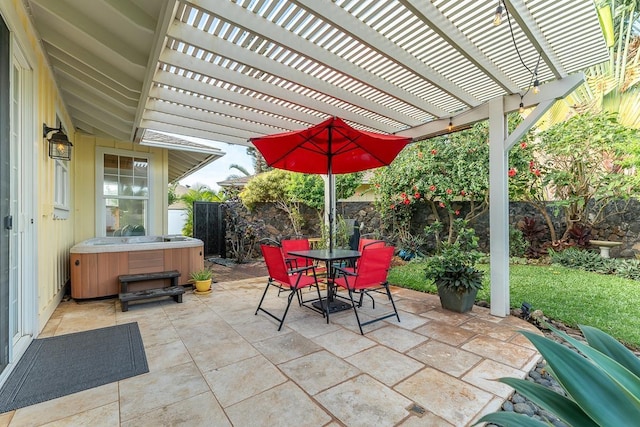 view of patio / terrace with a hot tub and a pergola