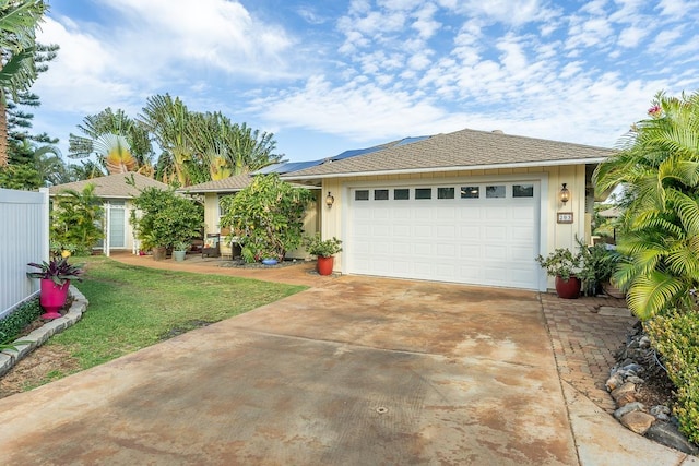 single story home with a garage and a front yard