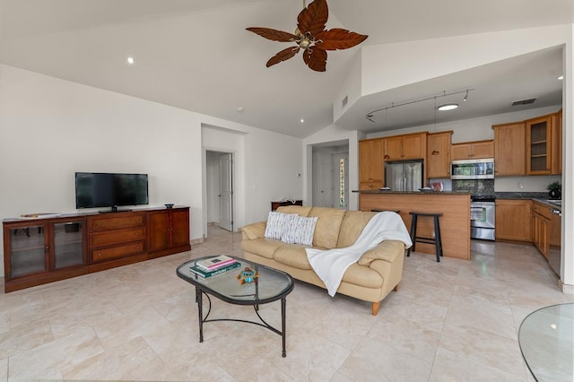 living room with high vaulted ceiling and ceiling fan