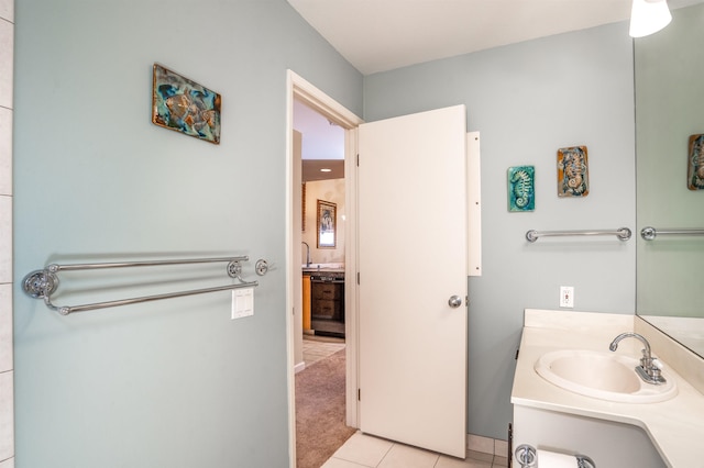 bathroom with tile patterned flooring and vanity