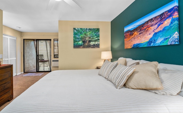 carpeted bedroom with ceiling fan and a closet