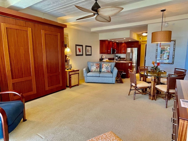 living room with light carpet and ceiling fan