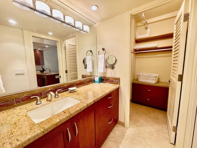 bathroom with vanity and tile patterned floors