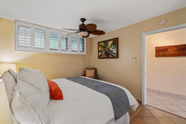 2936 S Kihei Rd Unit 213, Kihei, HI 96753 - bedroom featuring light tile patterned floors, baseboards, and a ceiling fan