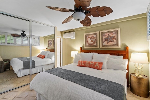 2936 S Kihei Rd Unit 213, Kihei, HI 96753 - bedroom with a wall mounted air conditioner, light tile patterned flooring, a closet, and a ceiling fan