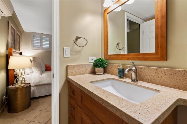 2936 S Kihei Rd Unit 213, Kihei, HI 96753 - bathroom with vanity, a wall unit AC, tile patterned floors, and connected bathroom