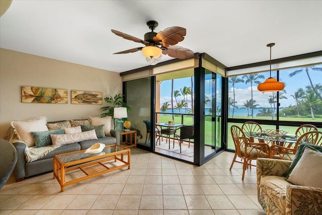 2936 S Kihei Rd Unit 213, Kihei, HI 96753 - living area with a wall of windows, a ceiling fan, and light tile patterned flooring