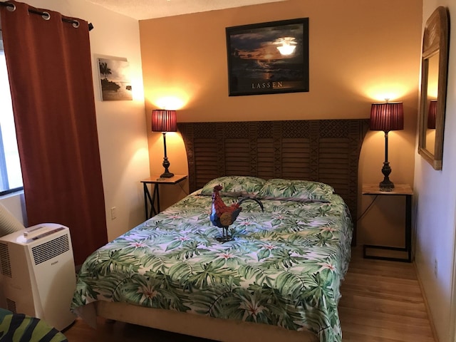 bedroom featuring hardwood / wood-style floors