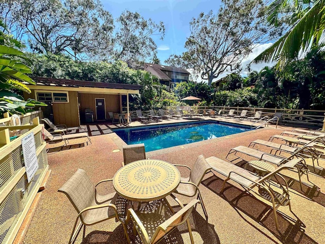 view of swimming pool with a patio area