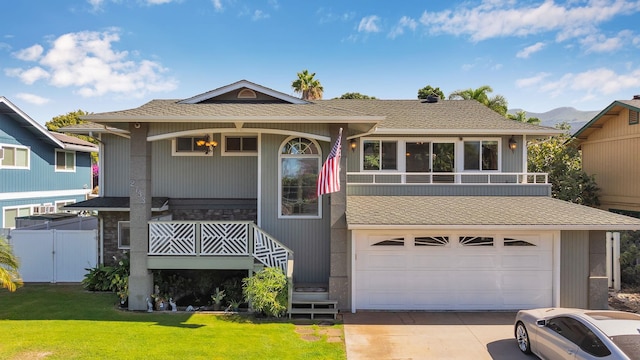 view of front facade featuring a front yard and a garage