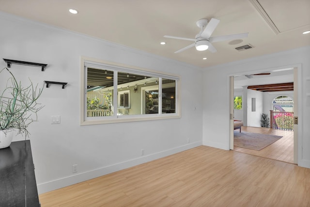 interior space featuring light hardwood / wood-style flooring, ceiling fan, and ornamental molding