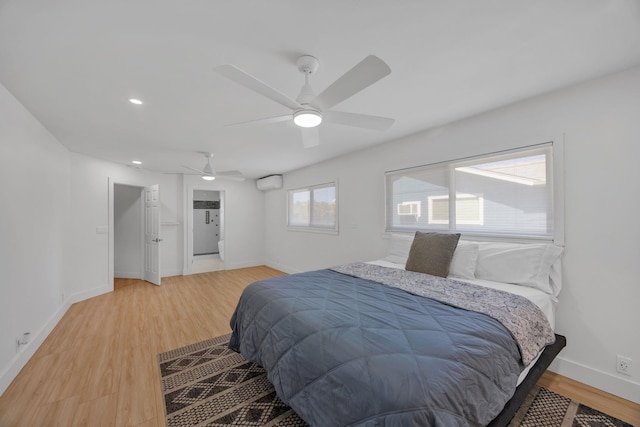 bedroom with hardwood / wood-style flooring and ceiling fan