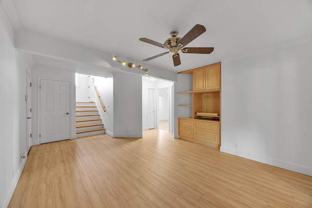 unfurnished living room featuring ceiling fan, light hardwood / wood-style flooring, and ornamental molding