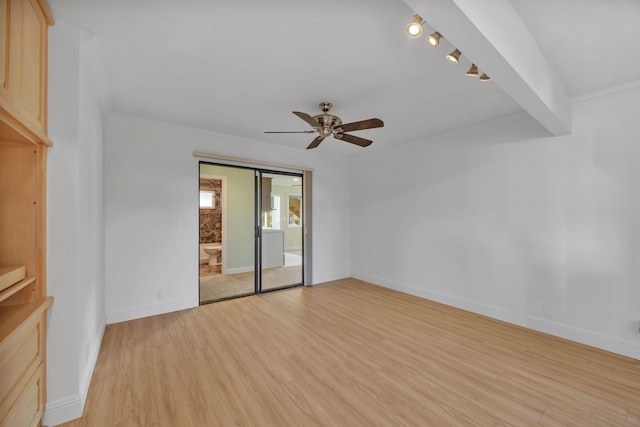 spare room featuring ceiling fan, beam ceiling, light wood-type flooring, and ornamental molding