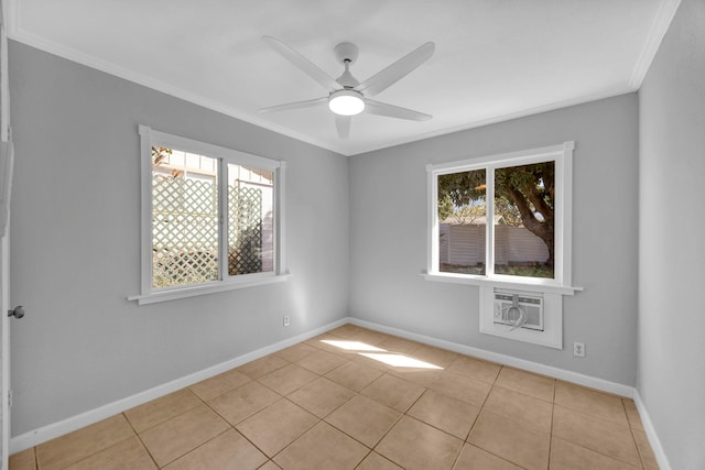 spare room featuring an AC wall unit, ceiling fan, crown molding, and light tile patterned flooring