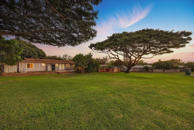 view of yard at dusk