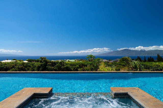 view of pool with a mountain view