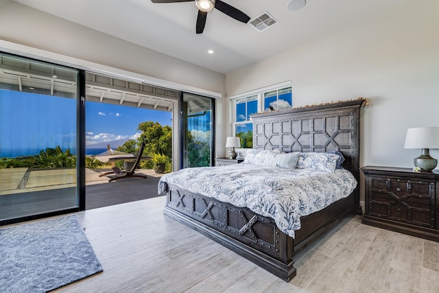 bedroom featuring ceiling fan, access to exterior, and light hardwood / wood-style flooring