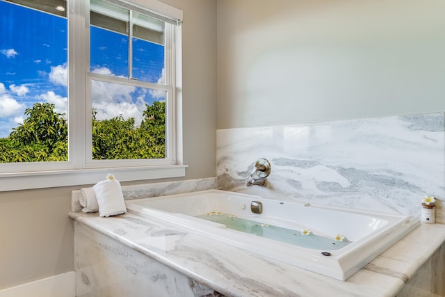 bathroom with tiled bath