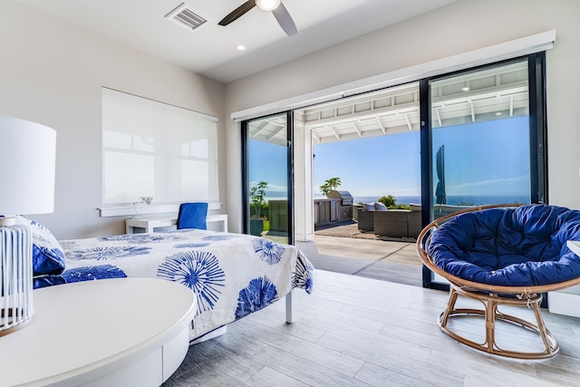 bedroom with hardwood / wood-style floors and ceiling fan