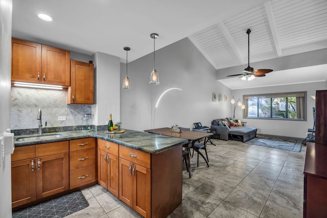 3788 Lower Honoapiilani Rd Unit A211, Lahaina, HI 96761 - kitchen with a sink, brown cabinets, backsplash, and a peninsula