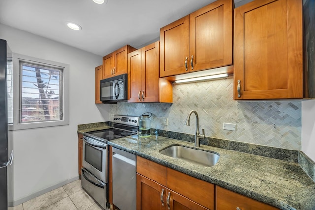 3788 Lower Honoapiilani Rd Unit A211, Lahaina, HI 96761 - kitchen with appliances with stainless steel finishes, a sink, backsplash, and dark stone countertops