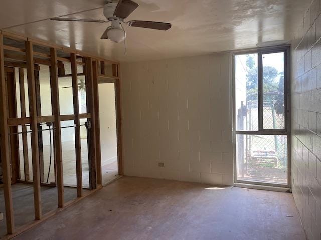 111 Kahului Beach Rd Unit A127, Kahului, HI 96732 - spare room with concrete block wall and a ceiling fan