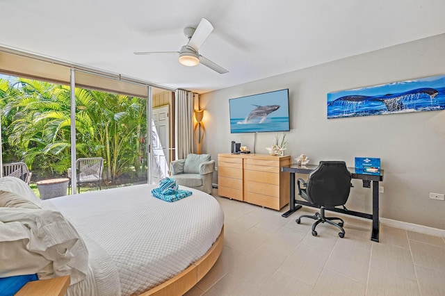 bedroom with ceiling fan, floor to ceiling windows, and baseboards