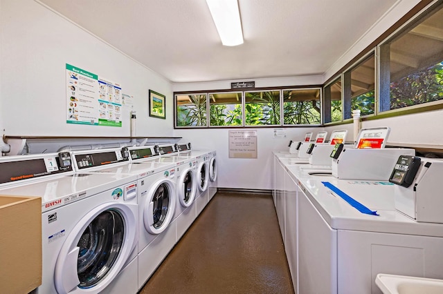 community laundry room featuring independent washer and dryer