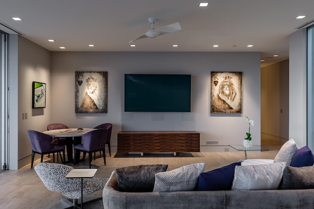 living room with light hardwood / wood-style floors and ceiling fan