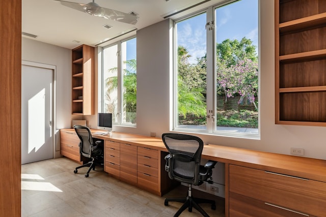 home office featuring built in desk and a wealth of natural light