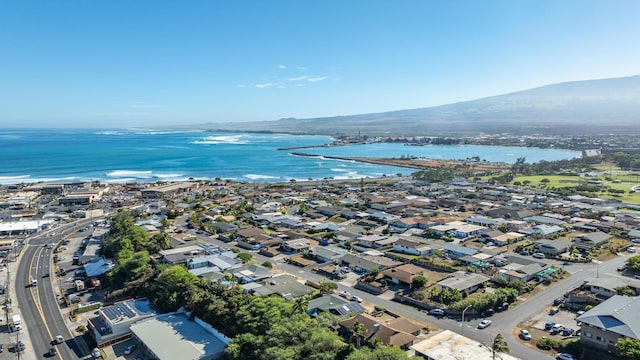 birds eye view of property featuring a water and mountain view