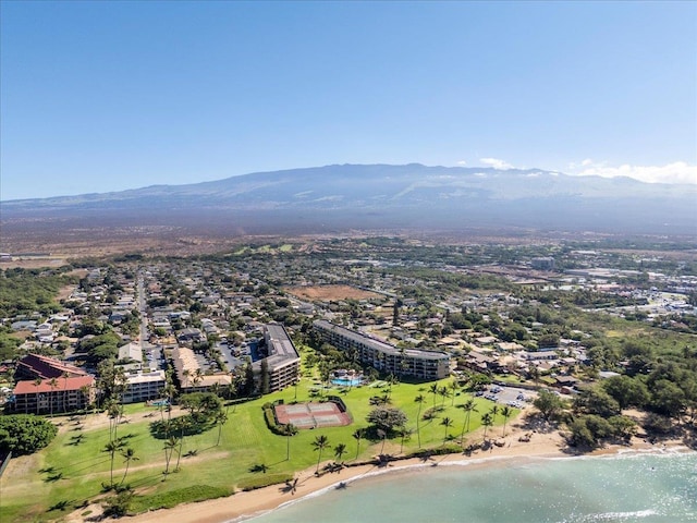 drone / aerial view featuring a water and mountain view