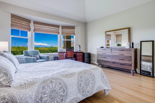 2177 Hihimanu St Unit 121, Kihei, HI 96753 - bedroom featuring hardwood / wood-style flooring and lofted ceiling