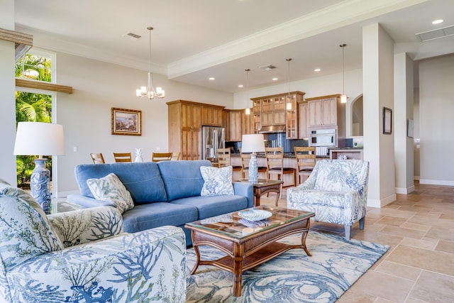2177 Hihimanu St Unit 121, Kihei, HI 96753 - living room featuring ornamental molding and a chandelier