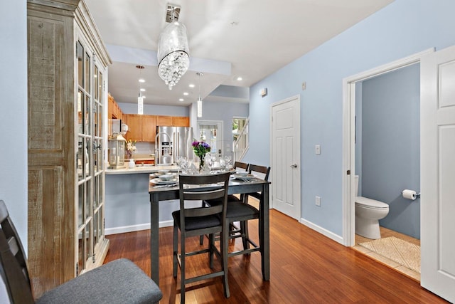 dining space featuring dark hardwood / wood-style floors